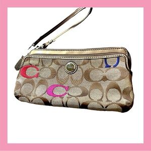 COACH Poppy multicolor embroidered double zip wristlet.  Metallic trim. 8”x 4.5”